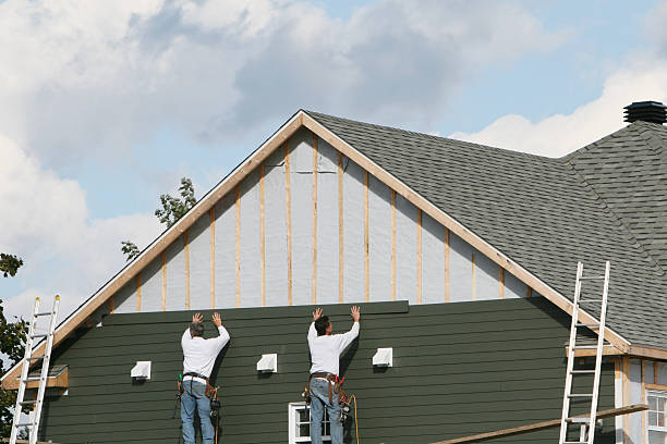 Professional Storm Damage Siding Repair technician working in Sumner, IL